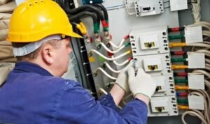 electrician electrical service and maintenance repair on an industrial electrical panel